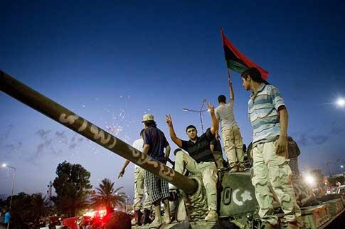 Libyans celebrate following the official declaration of liberation