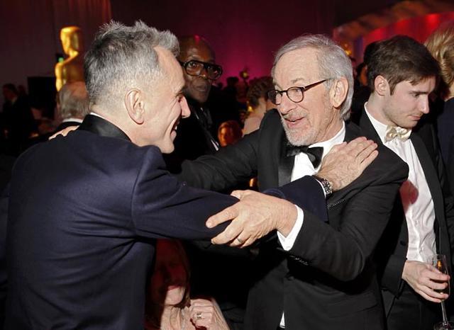 Day-Lewis, Best Actor Oscar for his role in "Lincoln", embraces director Spielberg at the Governors Ball following the 85th Academy Awards in Hollywood