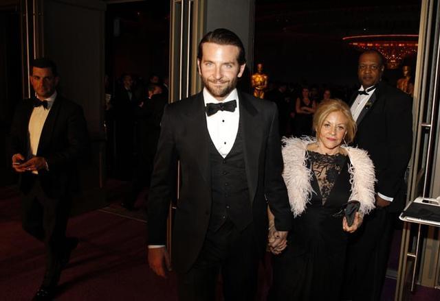 Bradley Cooper and his mother Gloria Cooper arrive at the Governors Ball for the 85th Academy Awards in Hollywood