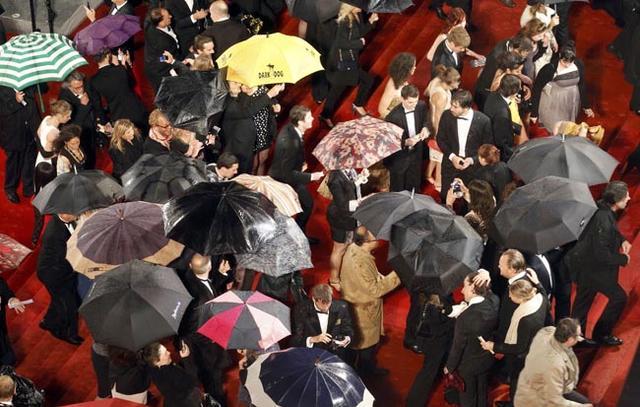 Guests arrive on the red carpet for the screening of the film Jagten in competition at the 65th Cannes Film Festival