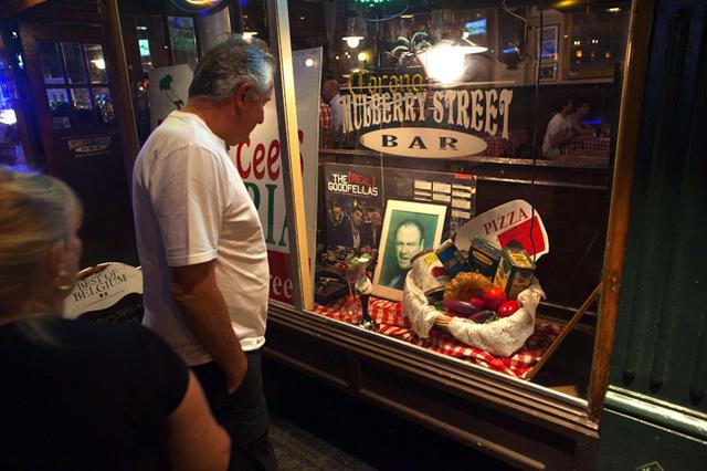 A picture of actor James Gandolfini is displayed in the window of a restaurant in the Little Italy neighborhood of New York