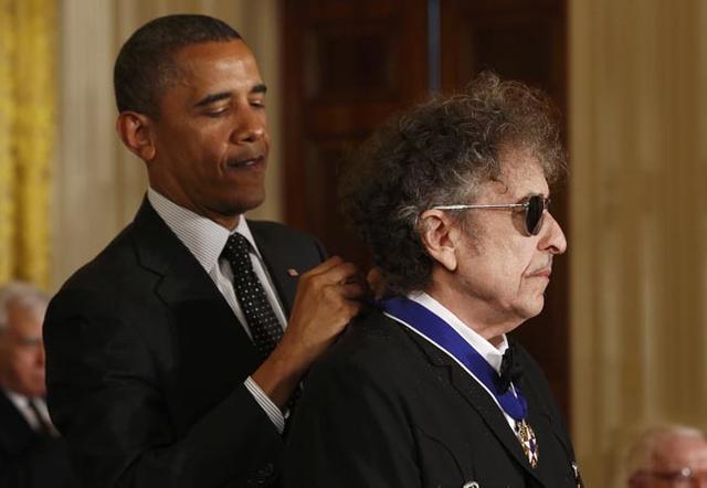 President Obama awards a 2012 Presidential Medal of Freedom to musician Bob Dylan during a ceremony in the East Room of the White House in Washington