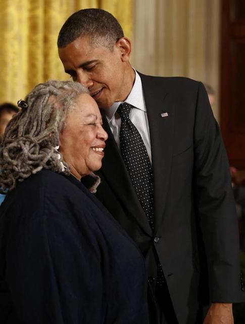 President Obama whispers to novelist Morrison as he prepares to award her a 2012 Presidential Medal of Freedom at the White House in Washington